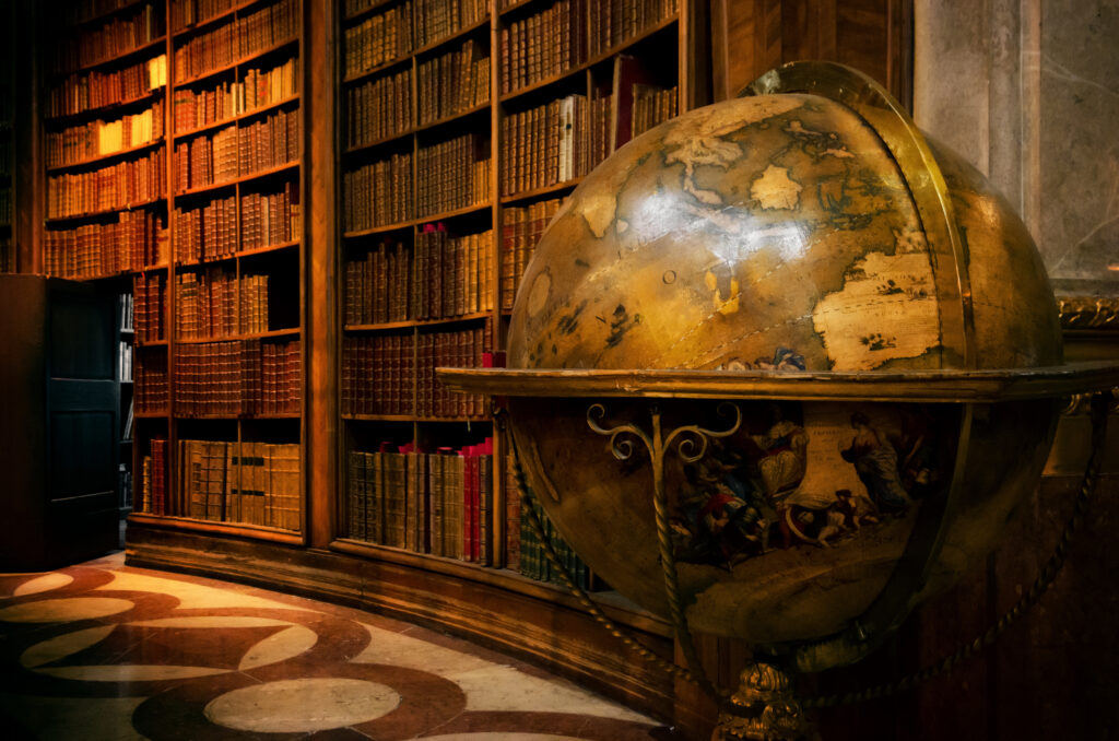 Vienna, Austria - May 20, 2017: Main hall of the historical Austrian National Library in Vienna (Austria) on may 20, 2017, with an ancient globe map